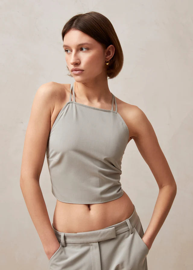 Light gray halter camisole with spaghetti straps and open back