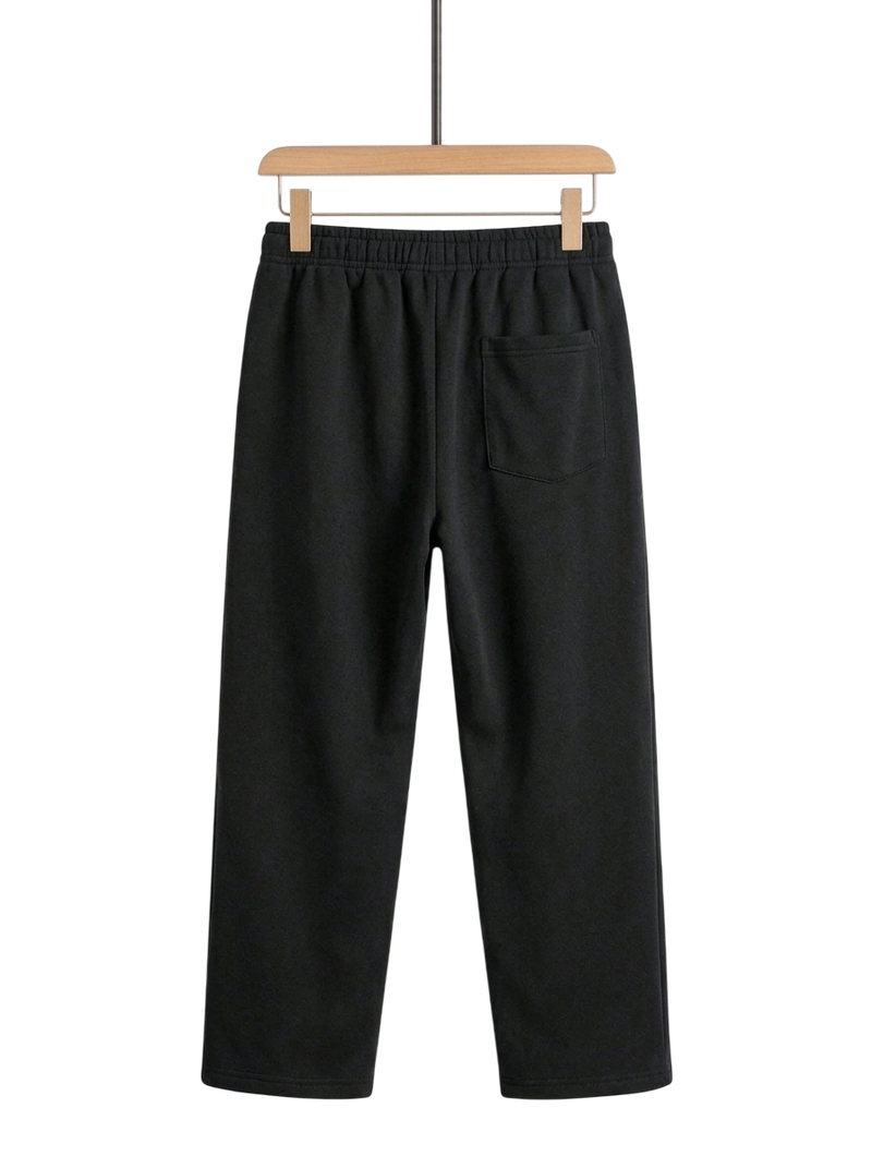 Black wide-leg sweatpants with an elastic waistband and a side pocket, hanging on a wooden hanger against a white background.